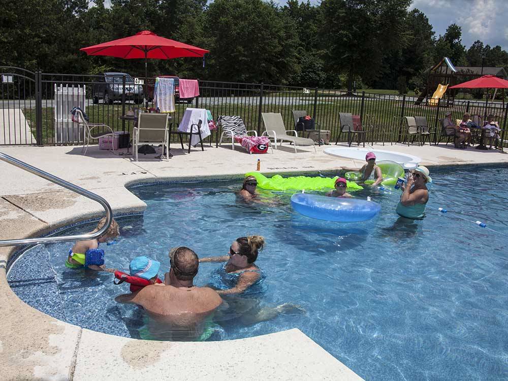 People playing in a pool at SCENIC MOUNTAIN RV PARK & CAMPGROUND