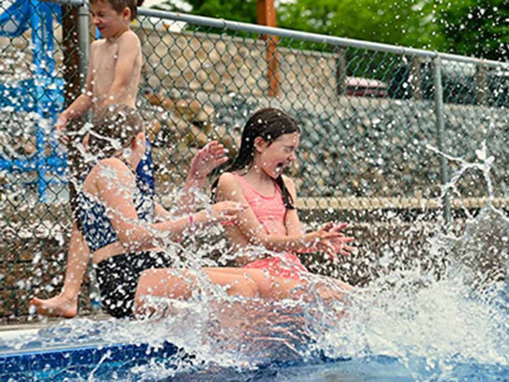 Kids splashing in the pool at STONYBROOK RV RESORT