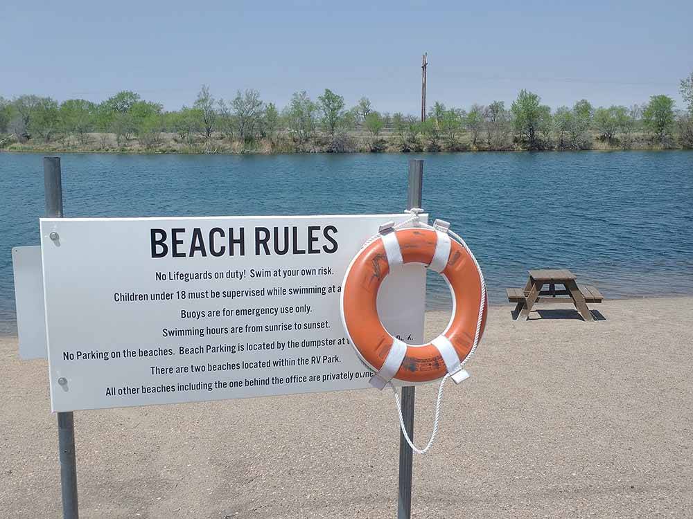 The beach rule sign with a lifesaver at KEARNEY RV PARK & CAMPGROUND