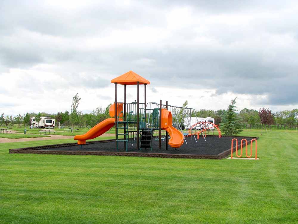 The playground area with slides at CAMPLAND RV RESORT
