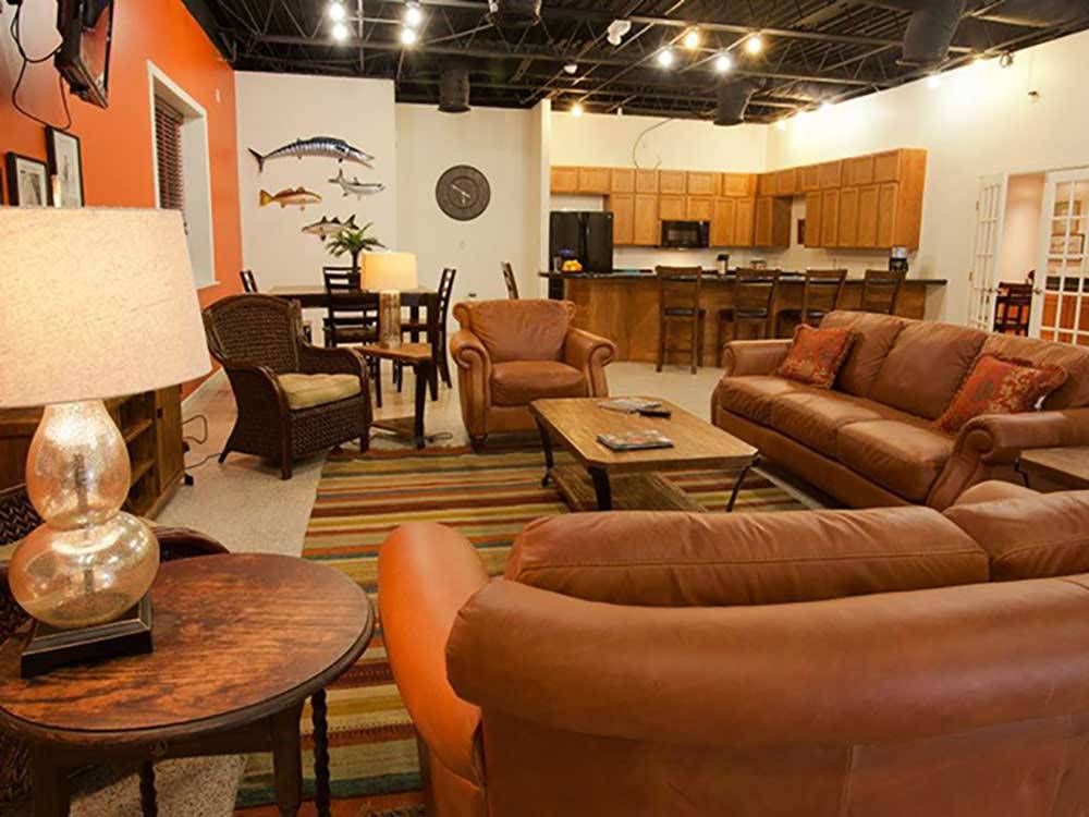 Brown leather couches in the rec room at SANDPIPER RV RESORT