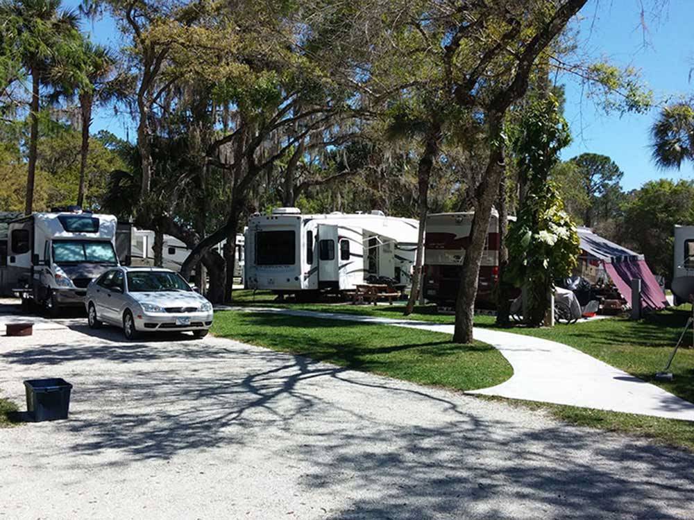 RV parked in tree shaded sites at SEMINOLE CAMPGROUND