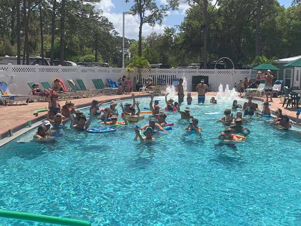 People playing in the swimming pool at SEMINOLE CAMPGROUND