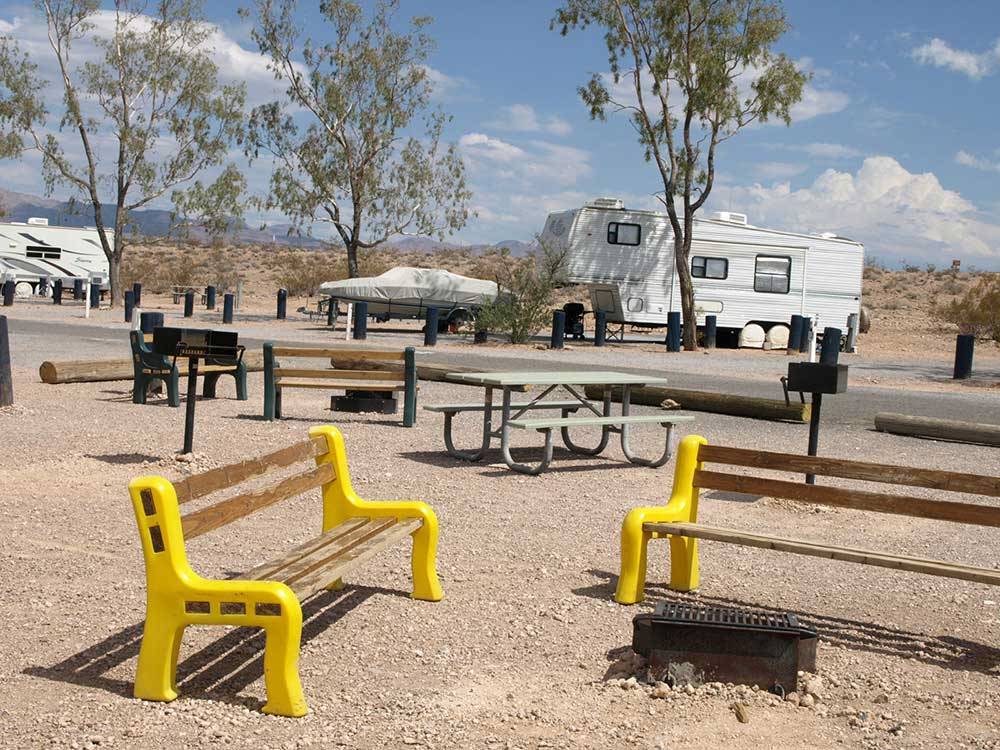 A group of benches and picnic tables at LAKE MEAD RV VILLAGE AT ECHO BAY