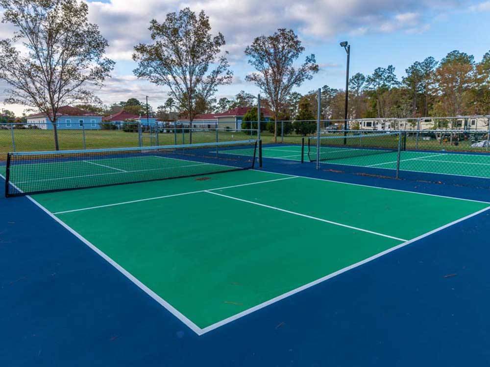 Tennis courts on-site at NORTH LANDING BEACH RV RESORT & COTTAGES