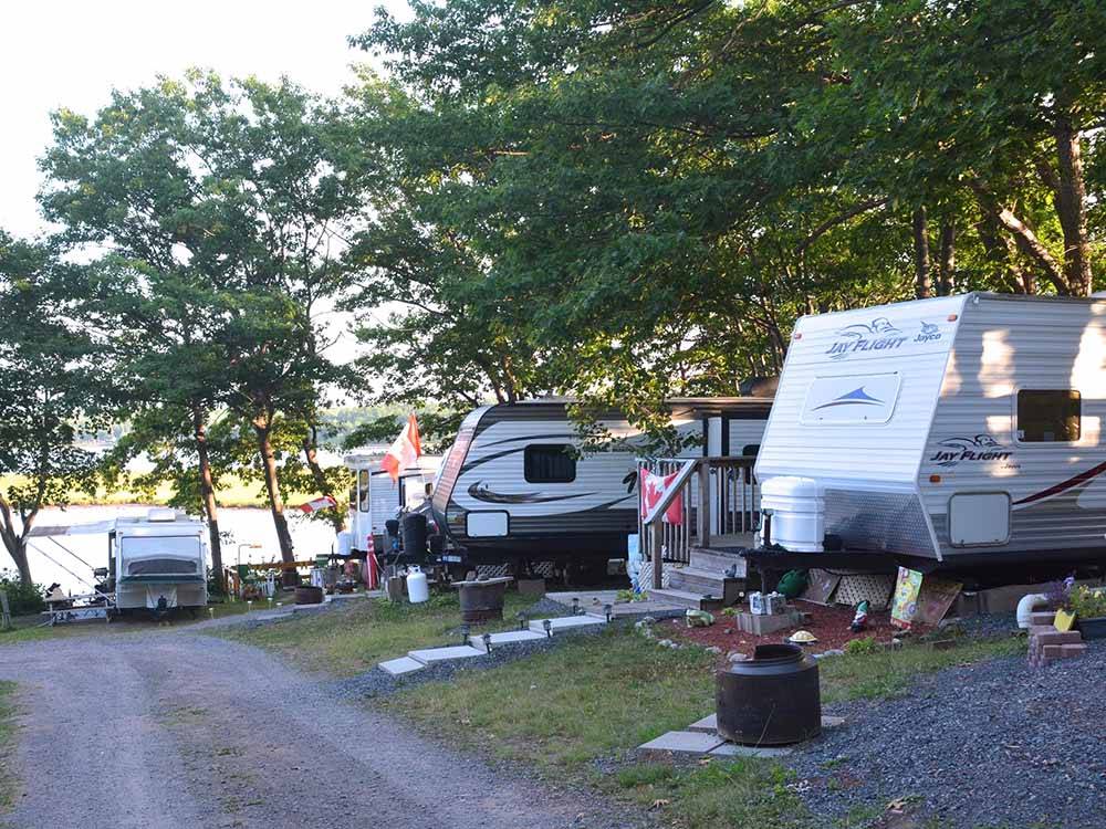A row of RV sites overlooking the water at HARBOUR LIGHT TRAILER COURT & CAMPGROUND