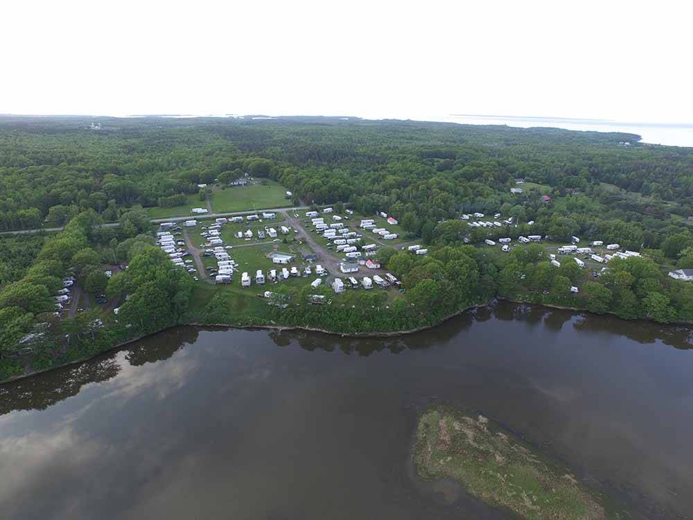 An aerial view of the water and campsites at HARBOUR LIGHT TRAILER COURT & CAMPGROUND