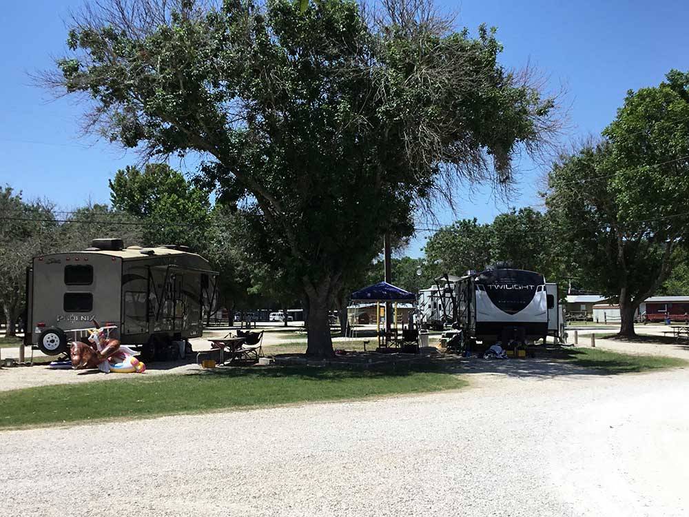 A row of gravel RV sites at RIO GUADALUPE RESORT