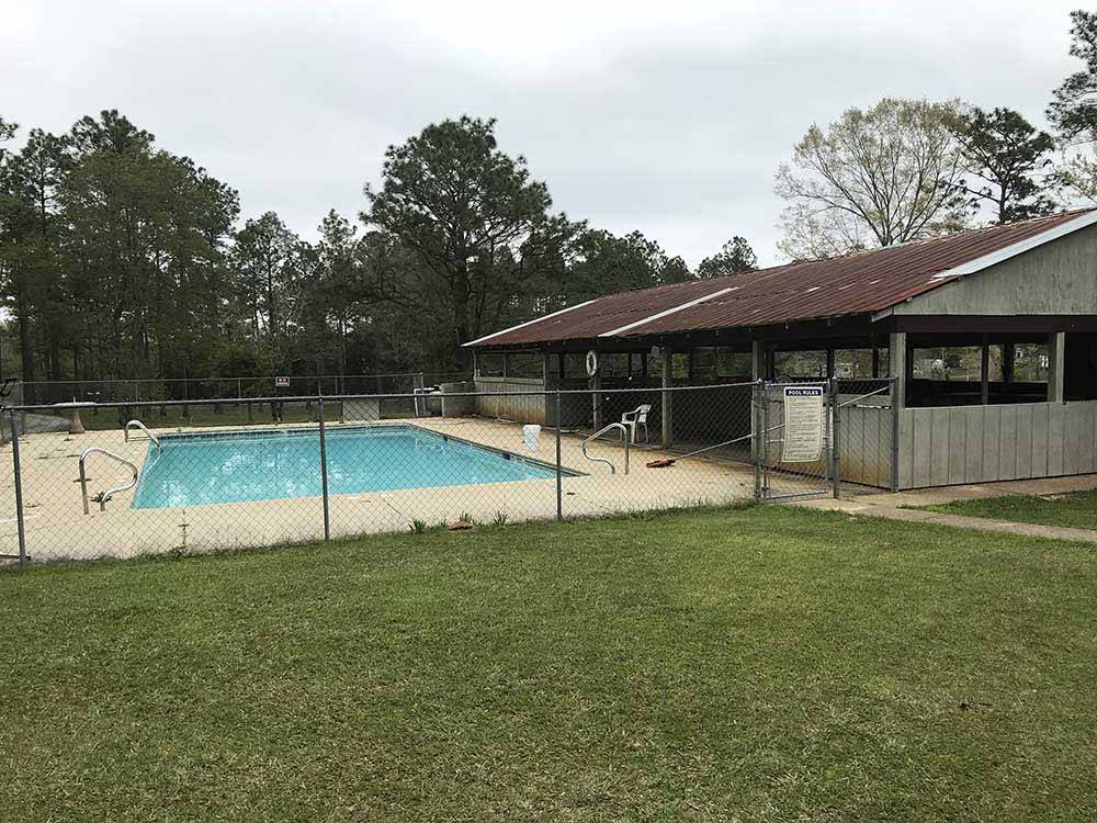 The swimming pool next to the pavilion at WILDERNESS RV PARK