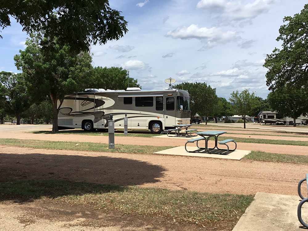 A picnic table between RV sites at PEACH COUNTRY RV PARK