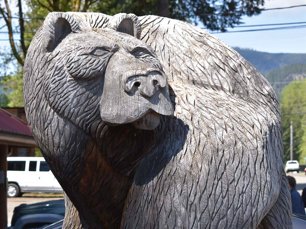 Sculpture of bear carved from wood at RAINIER WINGS / PACKWOOD RV PARK