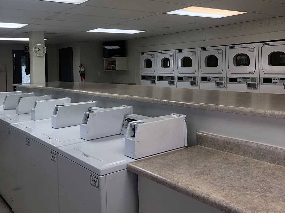 Washers and dryers in the laundry room at PALM GARDENS MHC & RV PARK