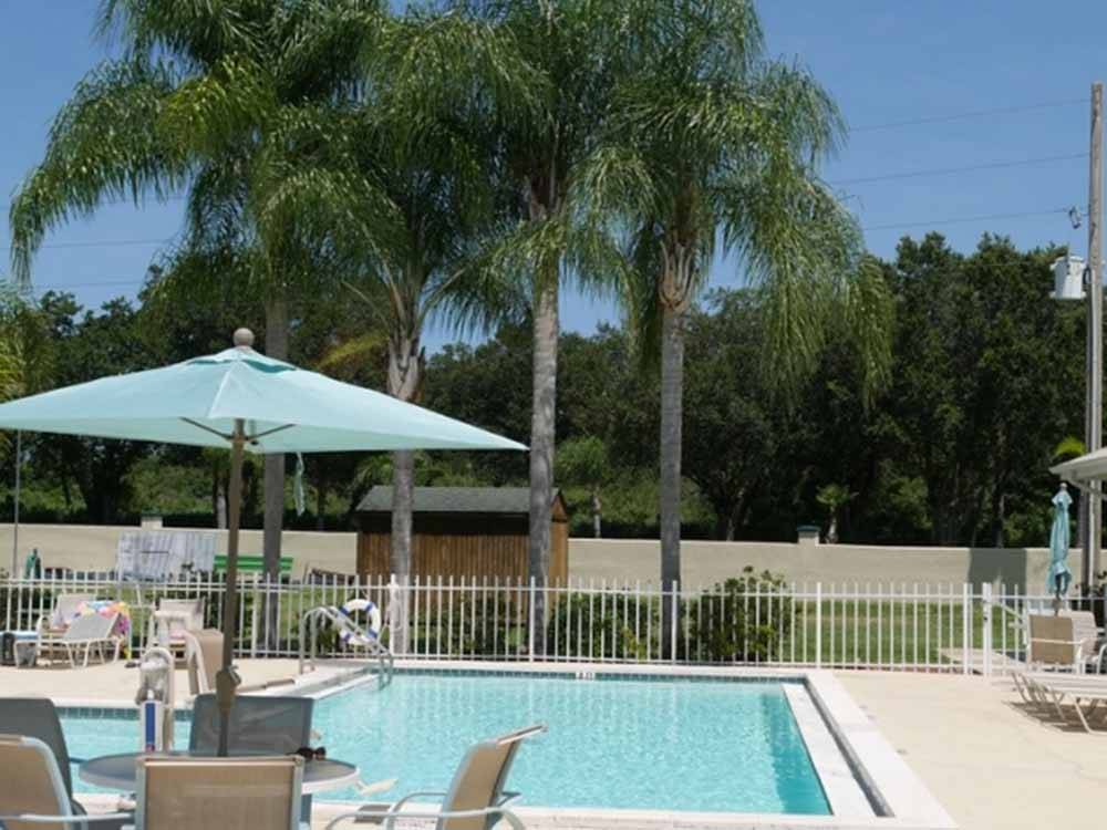 A view of the swimming pool with seating at FOREST LAKE VILLAGE RV RESORT