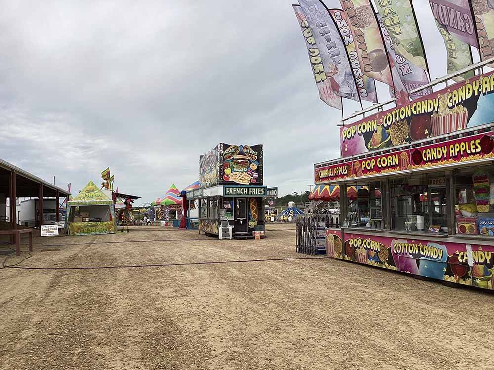 A carnival midway with food vendors at LINCOLN CIVIC CENTER RV PARK