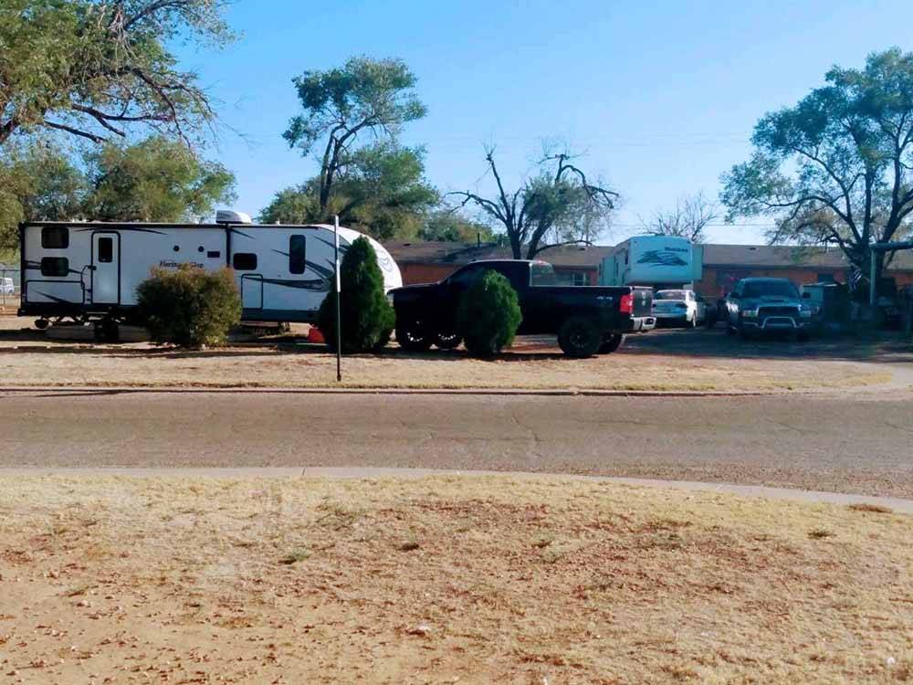View of RVs from across a road at CLOVIS RV PARK