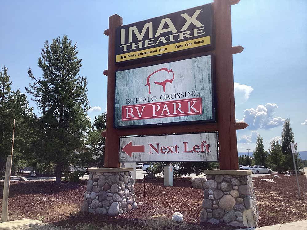 Sign indicating IMAX Theatre and Buffalo Crossing RV Park at BUFFALO CROSSING RV PARK