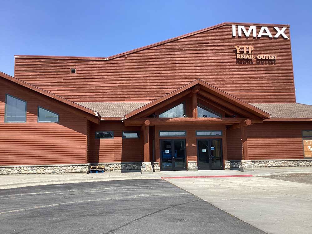 Rust-colored IMAX Theatre at BUFFALO CROSSING RV PARK