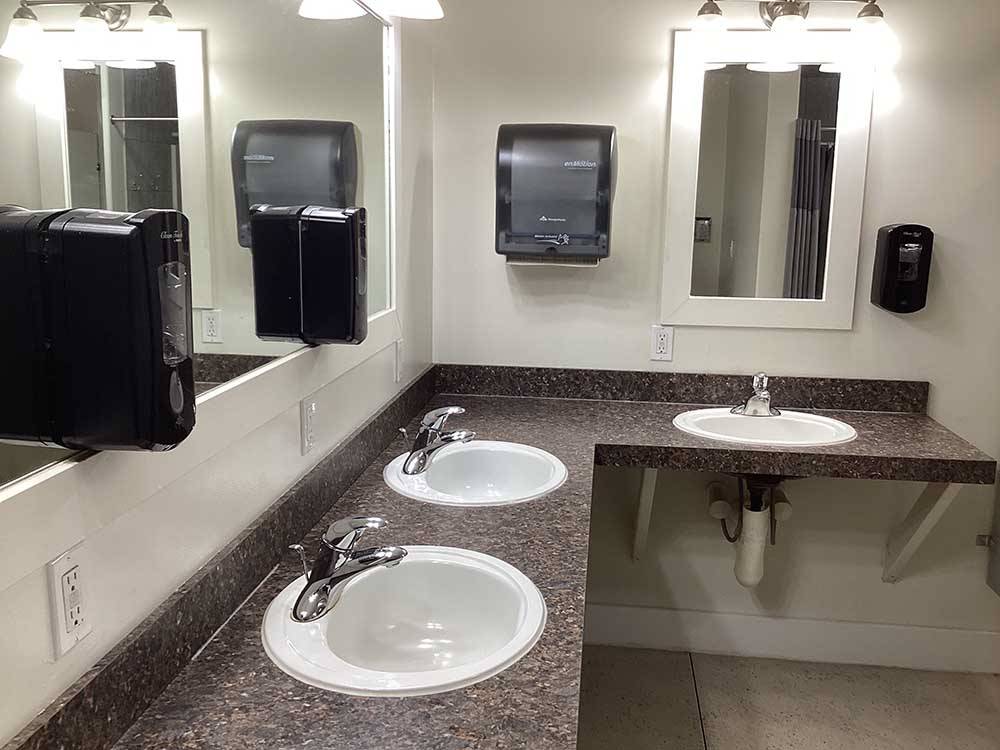 Bathroom sinks and smooth countertops at BUFFALO CROSSING RV PARK