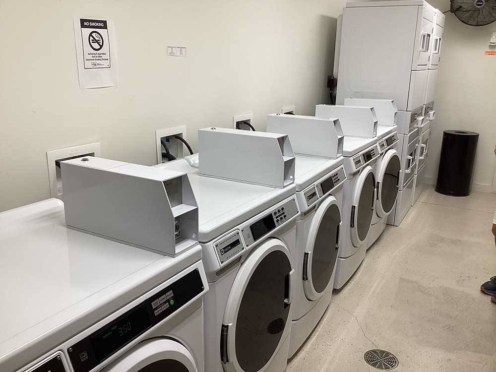 Row of dryers in campground laundry facility at BUFFALO CROSSING RV PARK