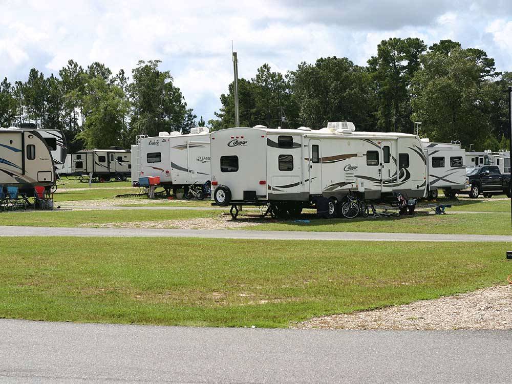 A lot of travel trailers parked in gravel sites at VALDOSTA OAKS RV PARK