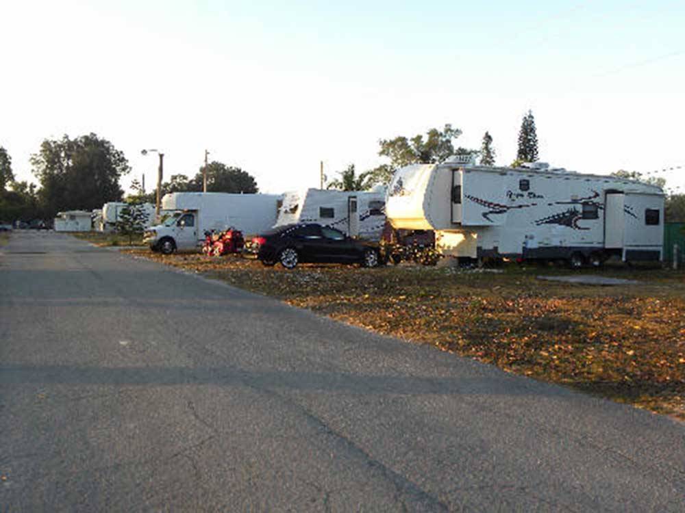 A row of filled RV sites at LAZY J RV & MOBILE HOME PARK