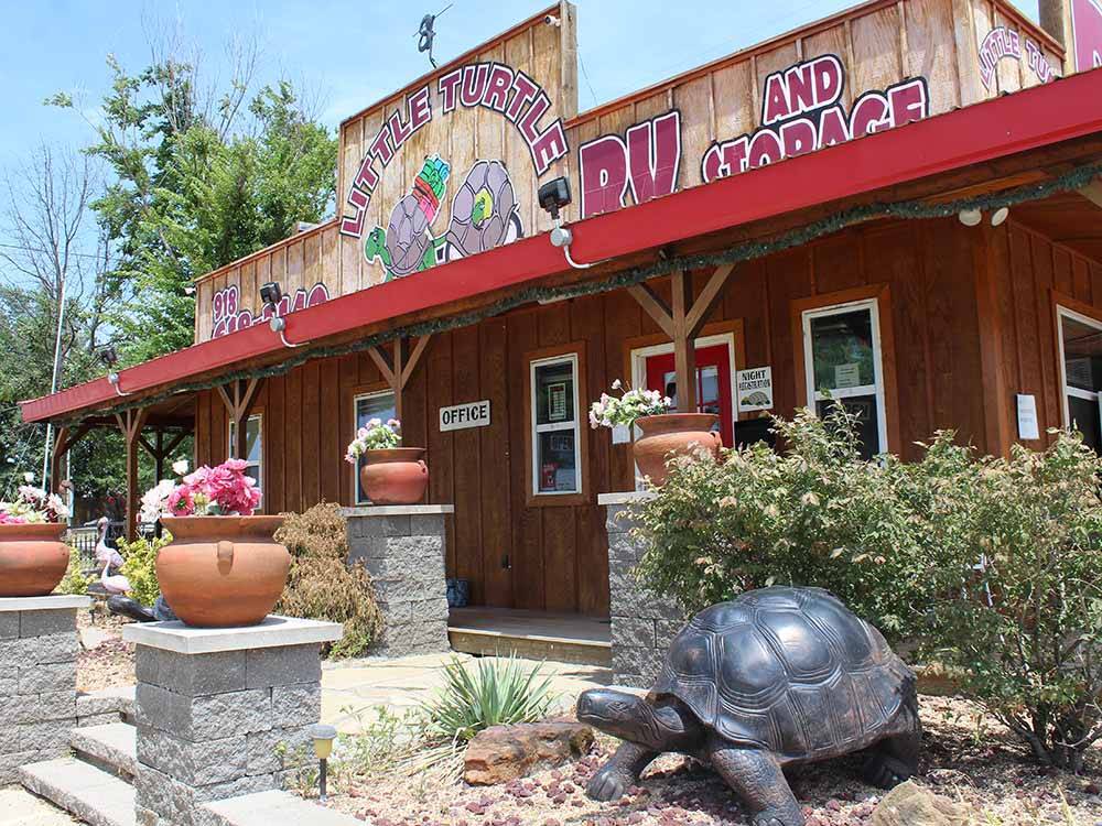 A big turtle statue in front of the office at LITTLE TURTLE RV & STORAGE