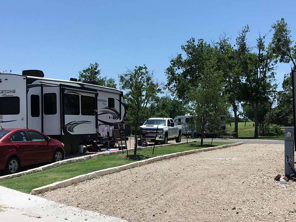A couple of gravel RV sites at FLAT CREEK FARMS RV RESORT
