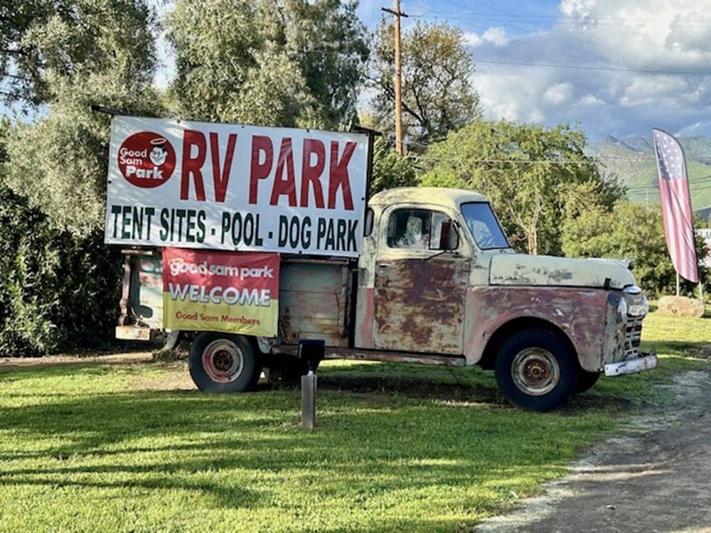 An old pick up truck with a park sign at LEMON COVE VILLAGE RV PARK