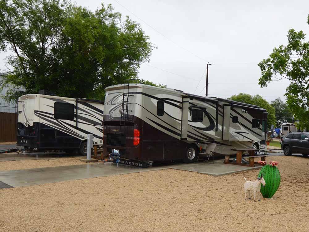 A couple of motorhomes in paved sites at MISSION CITY RV PARK