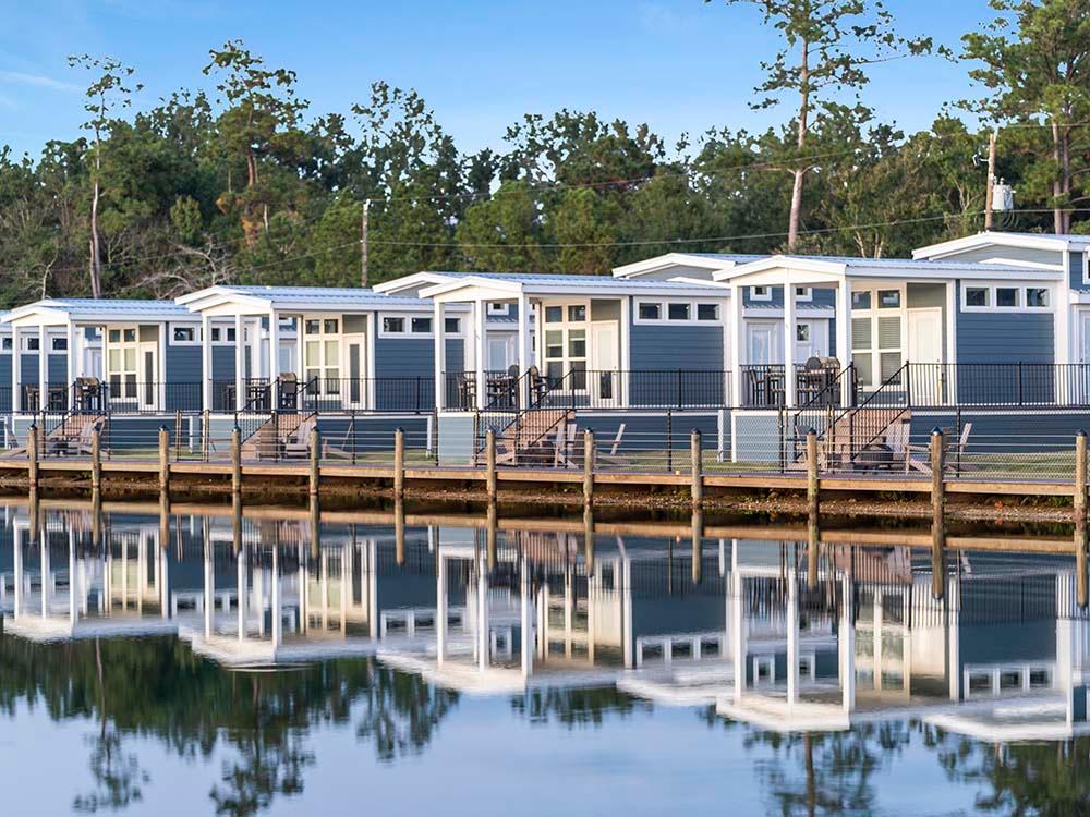 A row of waterfront cottages at SUN OUTDOORS NEW ORLEANS NORTH SHORE