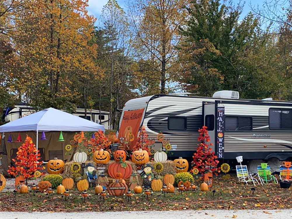 Carved pumpkins in front of a fifth wheel trailer at LAUREL LAKE CAMPING RESORT