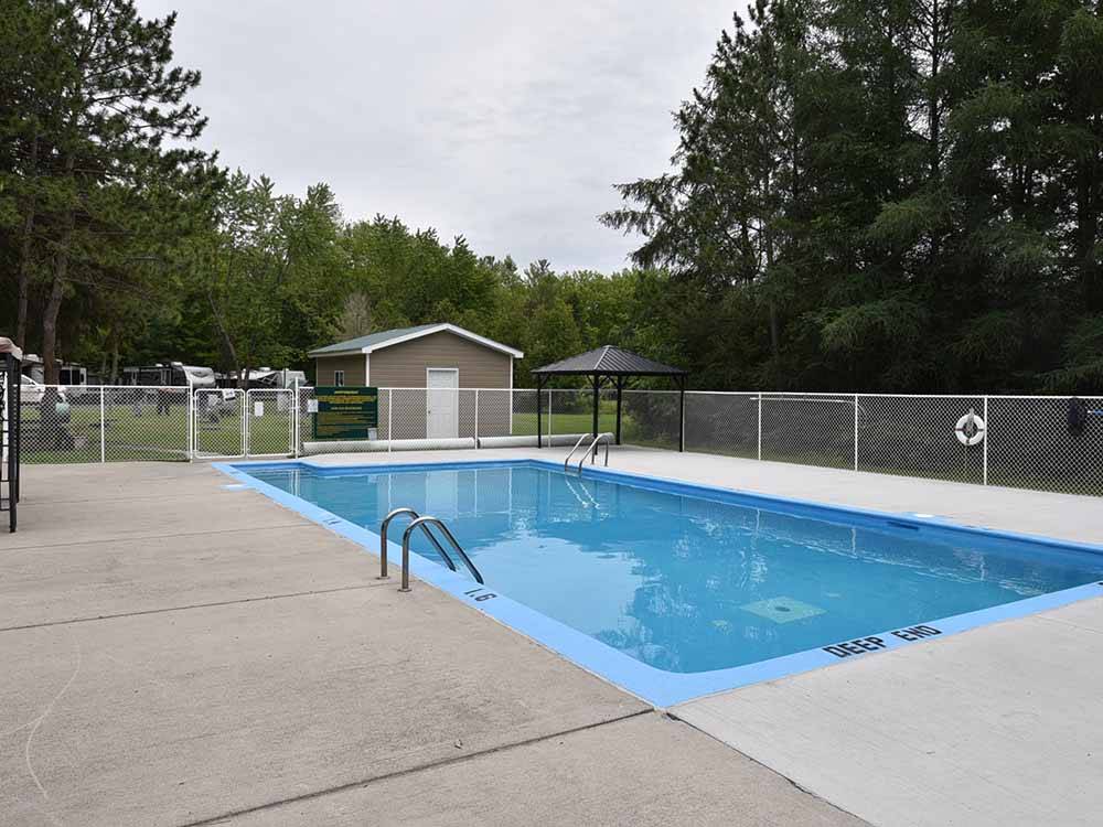 The swimming pool area at MAPLEWOOD ACRES RV PARK
