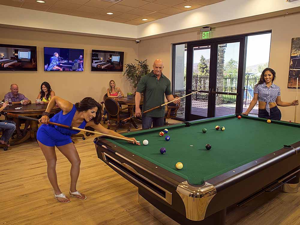 People playing pool and cards at PALA CASINO RV RESORT