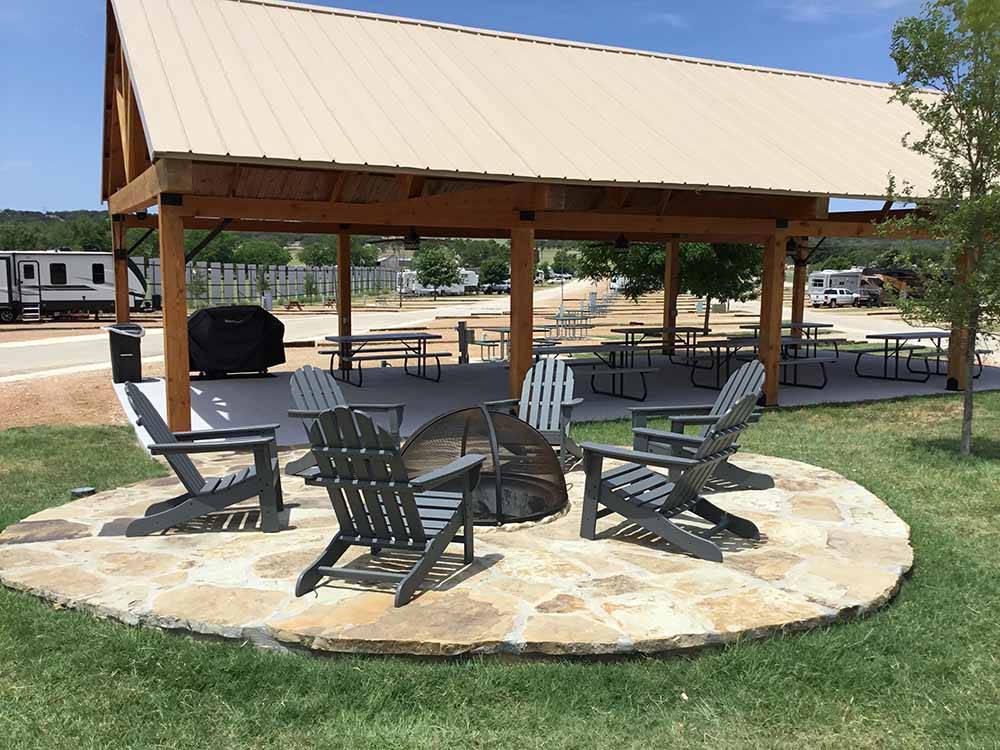 A ring of chairs around a fire pit at THE VINEYARDS OF FREDERICKSBURG RV PARK
