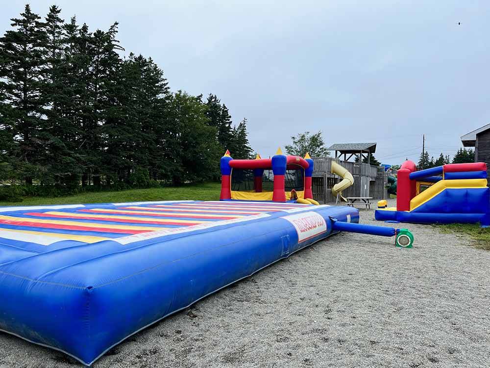 The jumping pad and bouncing houses at CASTLE LAKE CAMPGROUND & COTTAGES