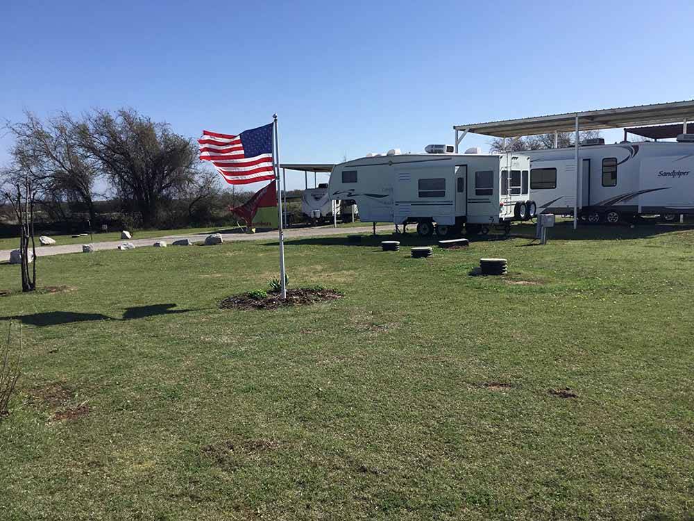 American flag with campers in background at WEST GATE RV PARK