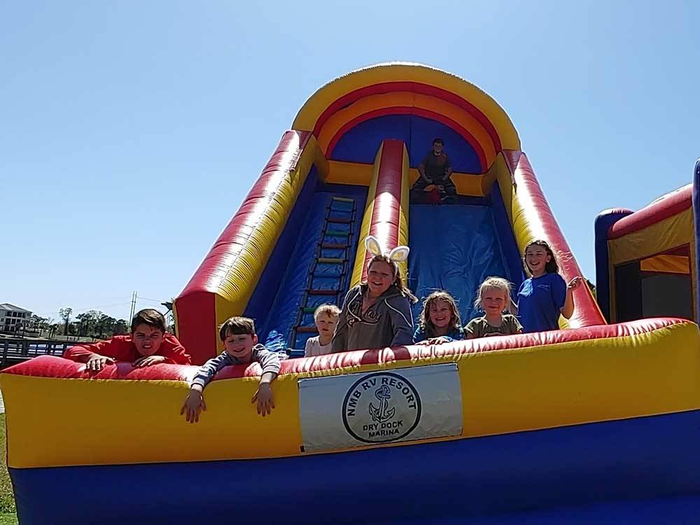 Children playing on inflatable slide at NMB RV RESORT AND DRY DOCK MARINA