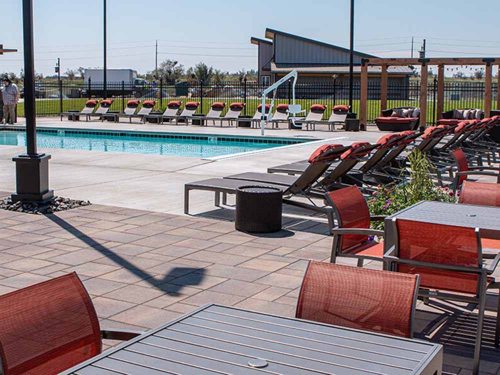 The pool area with seating at NORTHERN QUEST RV RESORT