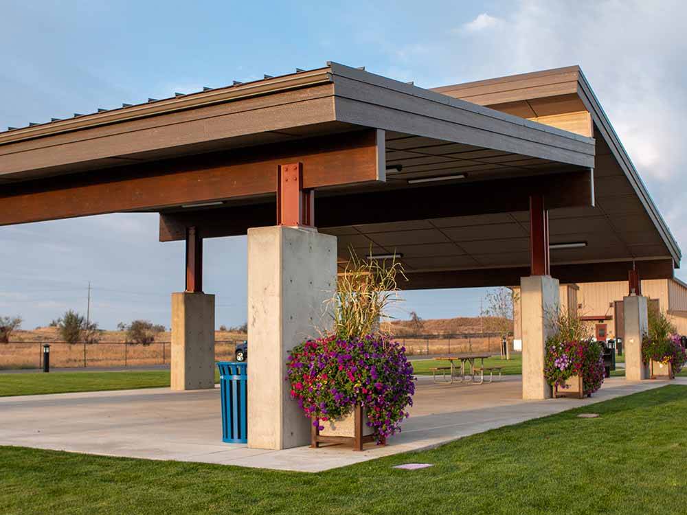 The pavilion with picnic benches at NORTHERN QUEST RV RESORT