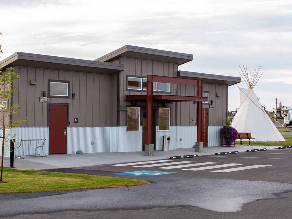 The restroom building with a teepee next to it at NORTHERN QUEST RV RESORT