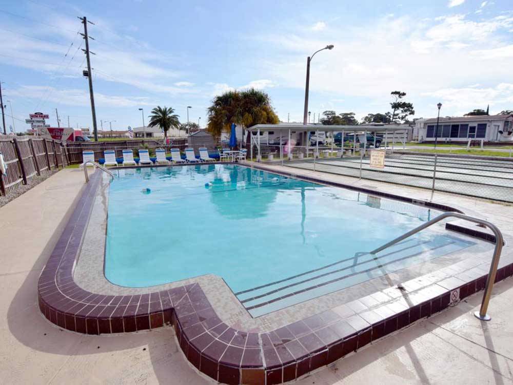 The outdoor pool next to the shuffleboard courts at WINTER PARADISE RV RESORT