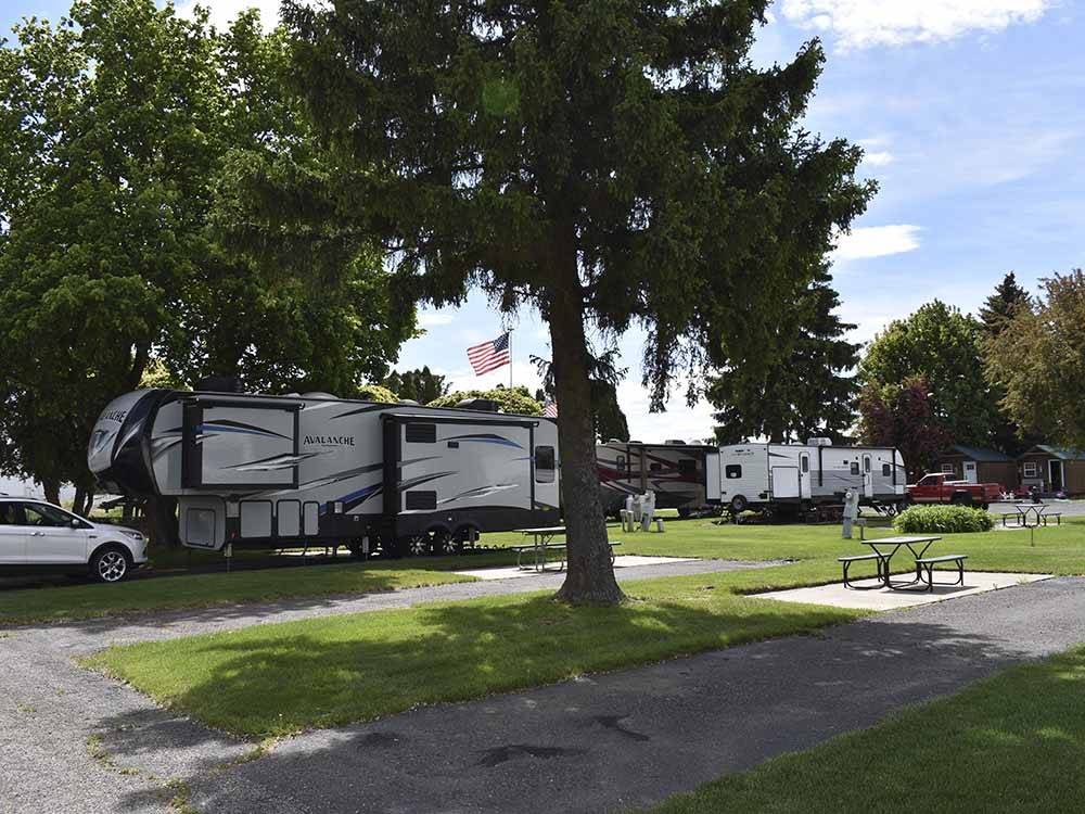 A row of paved back in RV sites at GOOSE CREEK RV PARK & CAMPGROUND