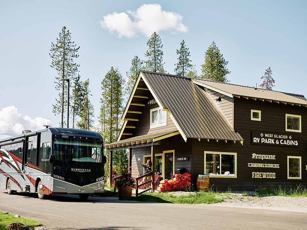 A class A motorhome checking in at the front office at WEST GLACIER RV PARK & CABINS