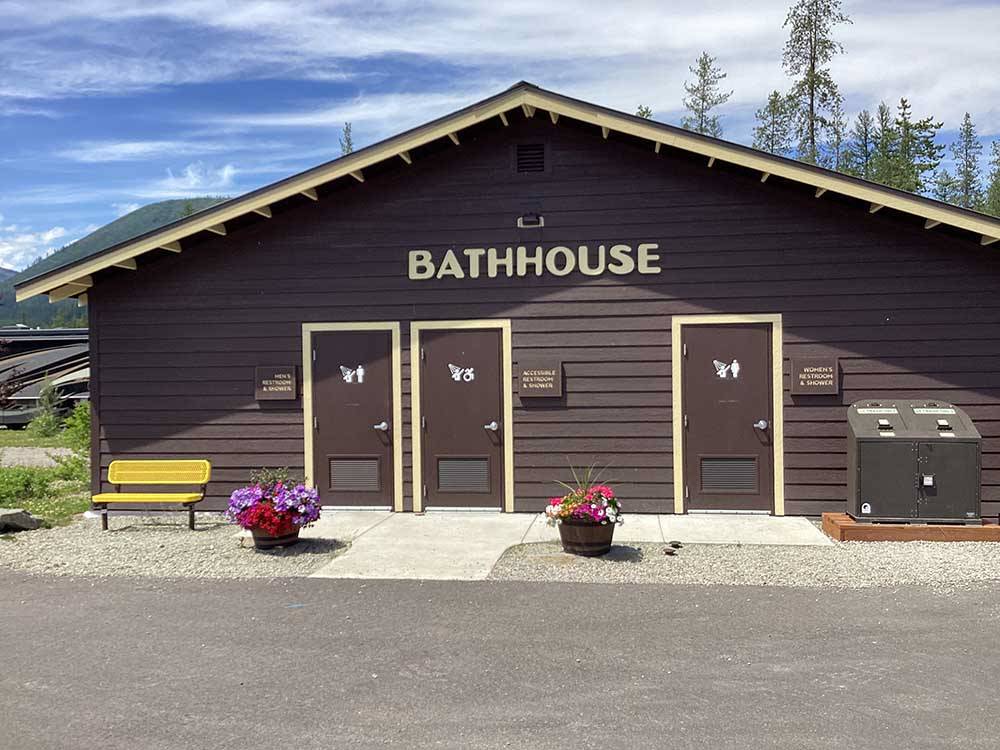 The brown bathhouse building at WEST GLACIER RV PARK & CABINS