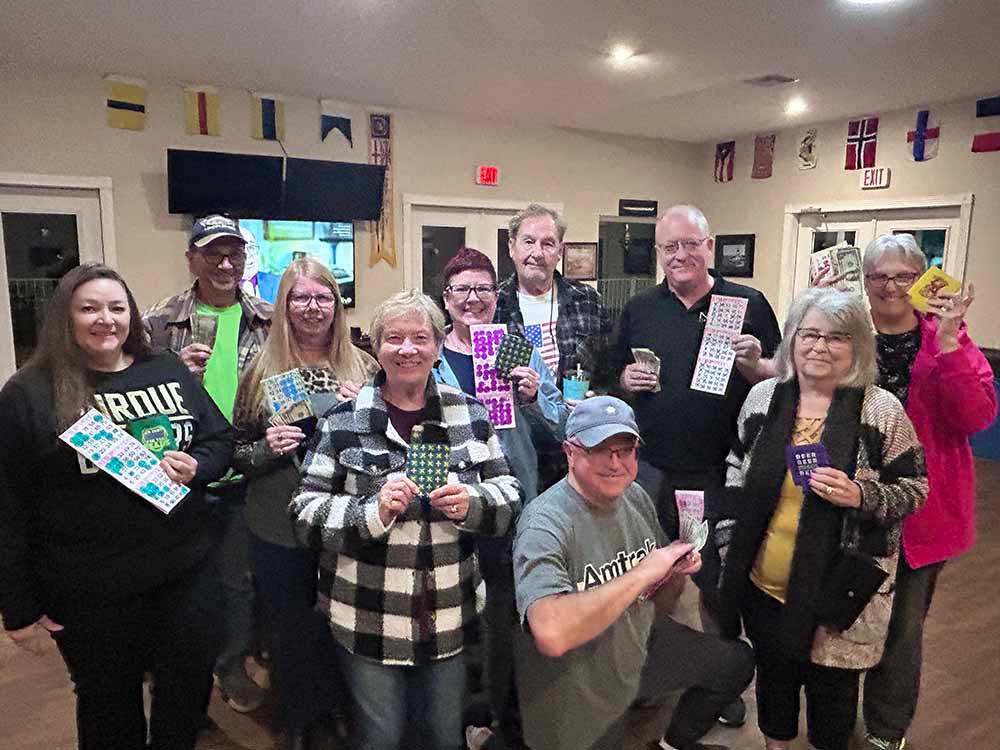 People showing off their game cards at AHOY RV RESORT