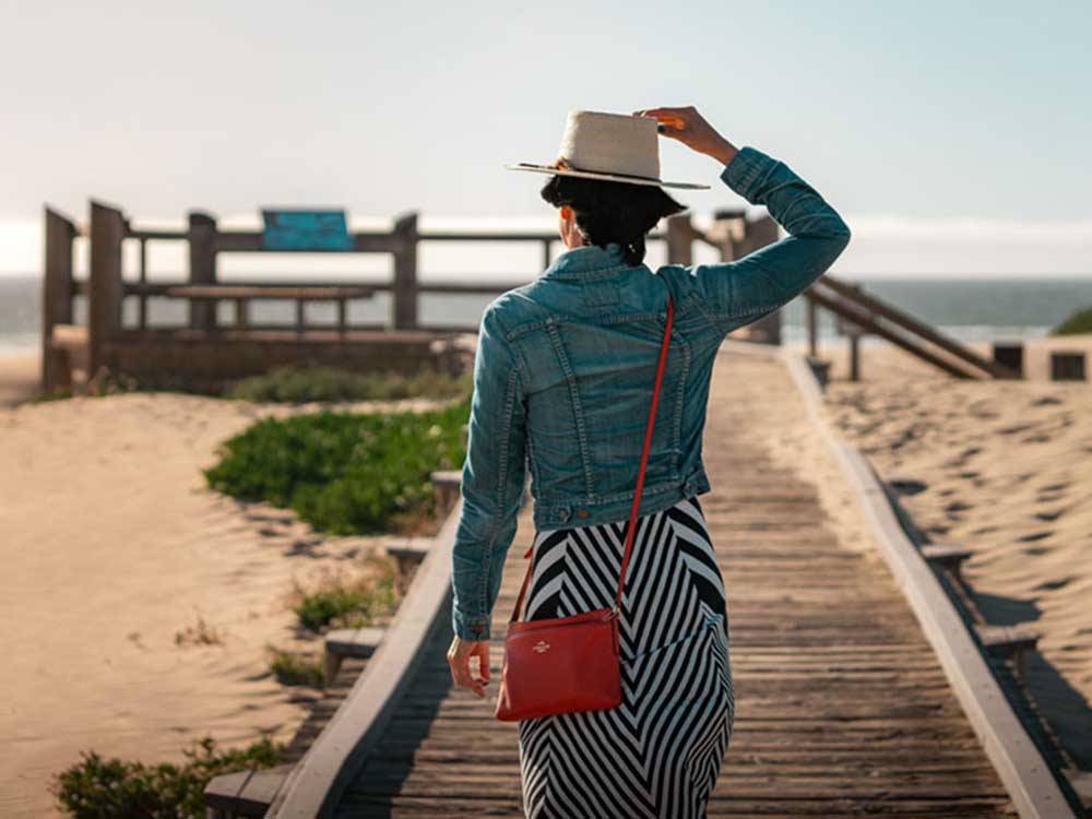 Woman walking towards pier at VISIT SLO CAL - SAN LUIS OBISPO COUNTY