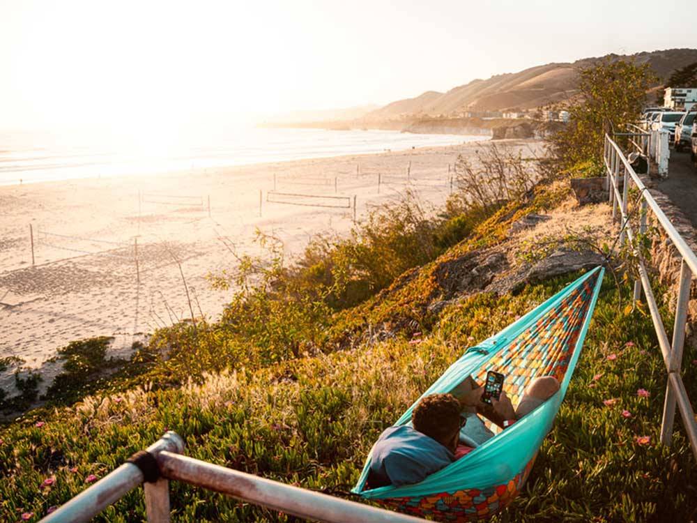 A woman resting on a hammock at VISIT SLO CAL - SAN LUIS OBISPO COUNTY