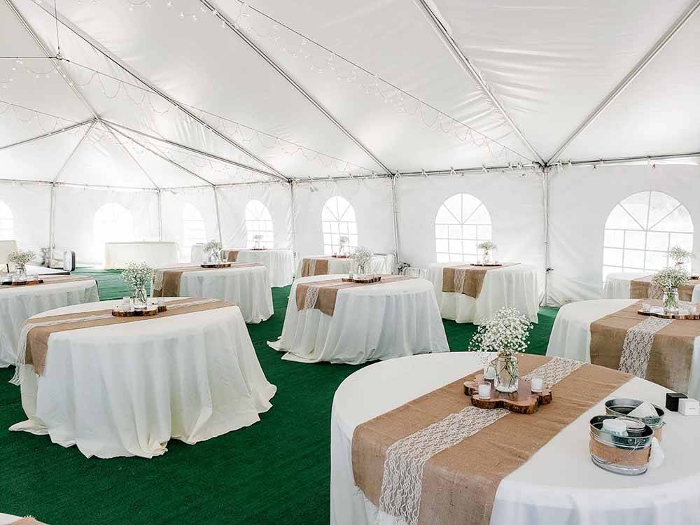 The inside of a tent for a celebration at CREEKFIRE RESORT