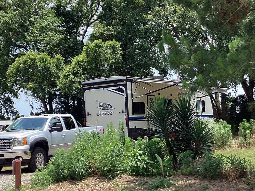 Travel trailer in a gravel site at ALABAMA COAST CAMPGROUND