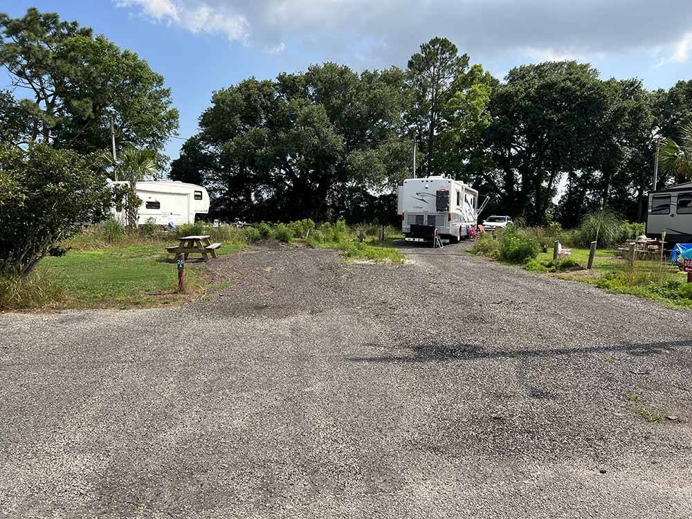 Trailers parked in gravel sites at ALABAMA COAST CAMPGROUND